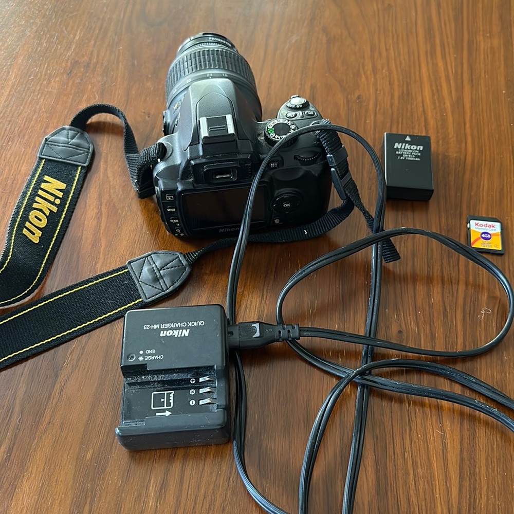 Nikon D60 digital camera with 4GB memory card, lens, battery, & charger included